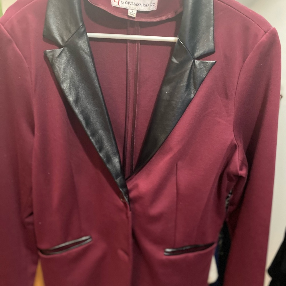 Burgundy jacket with black faux leather lapels and pocket trim